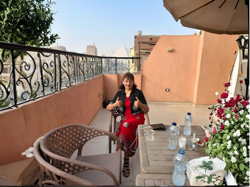 Rooftop terrace with pyramid views