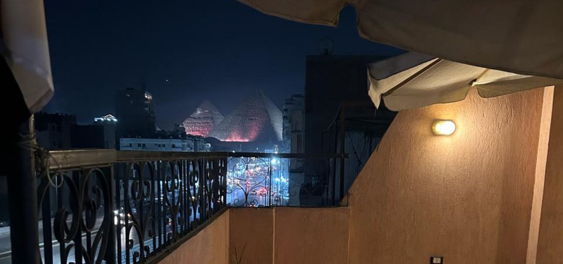 The rooftop terrace looking out over the Great Pyramids of Giza